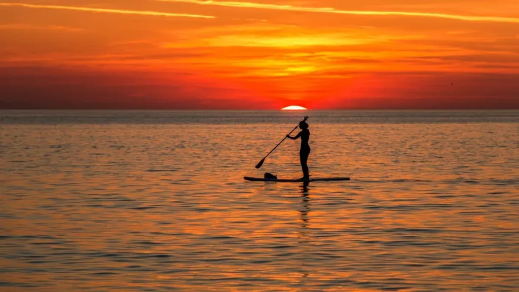 Stand up paddle boarding in the sunset