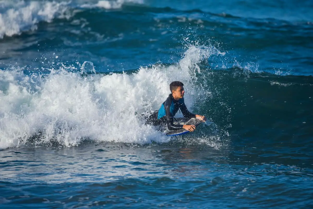 Body boarding - riding a wave in the ocean