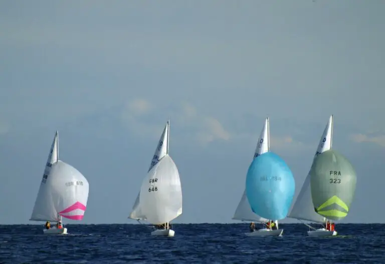 how to get started with racing in sailing - 4 boats with spinnakers racing