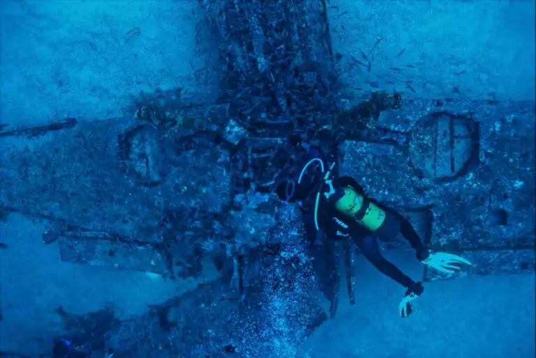How to get started with wreck diving - a photo of a guy exploring a wreck