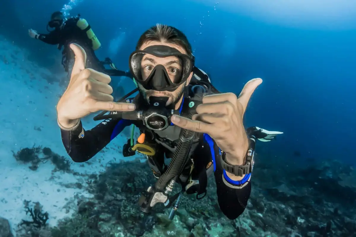 how hard is diving - guy doing cool signs to the camera